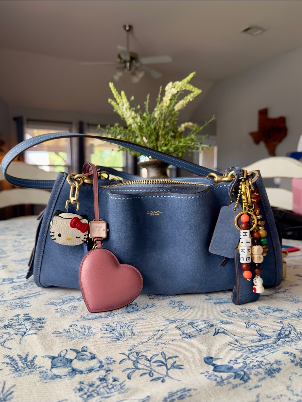 Coach Rogue 34 in light Denim.